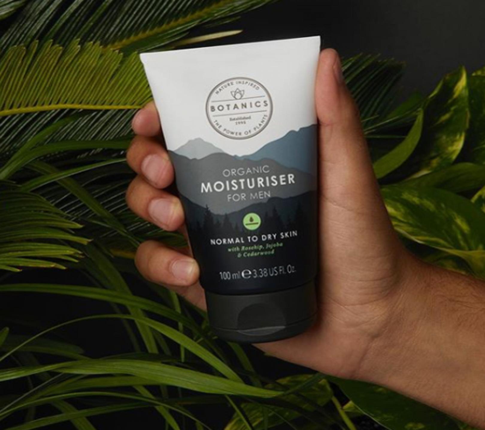 Hand holding the recycled plastic Botanics Moisturizer