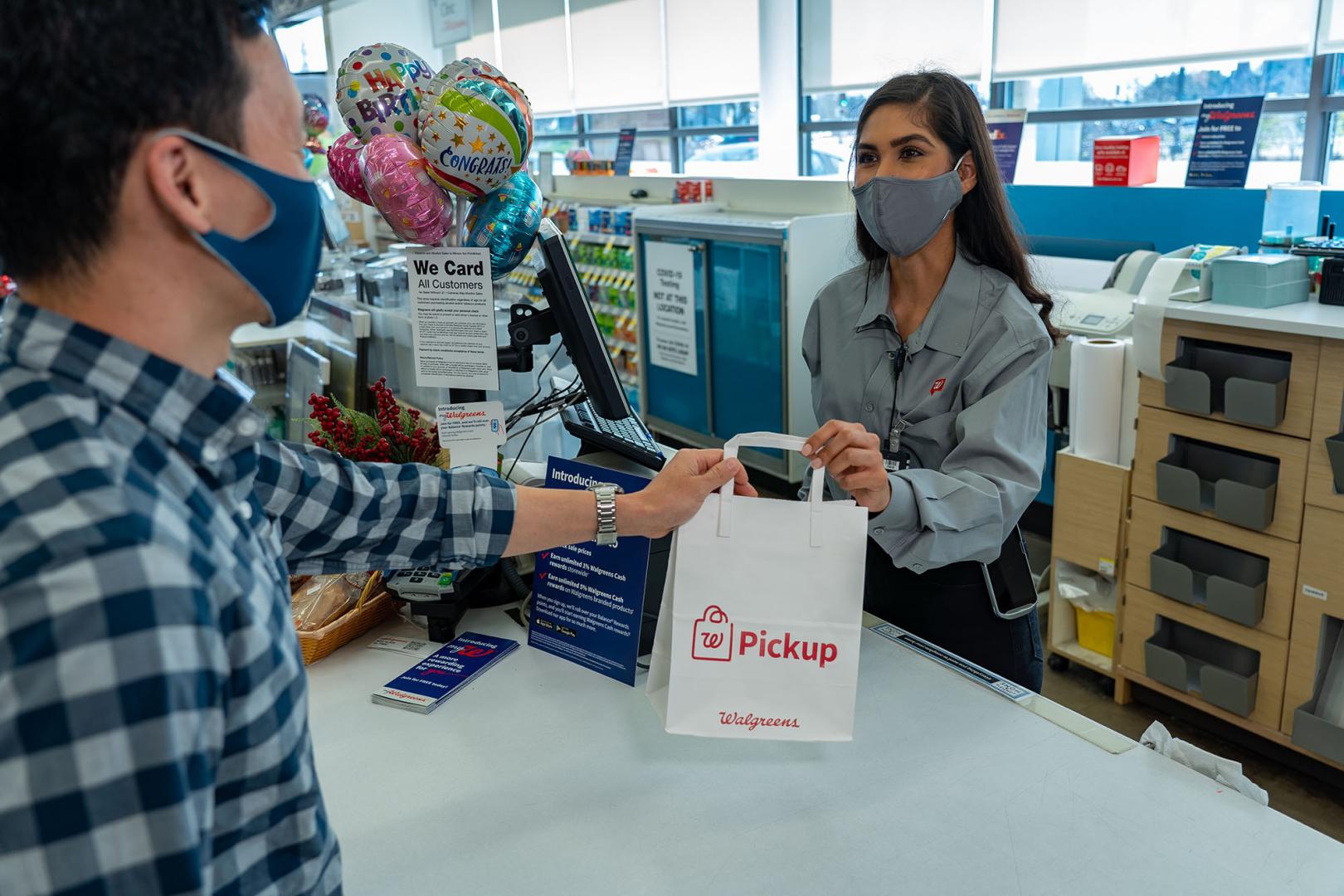 Walgreens team member serving a customer