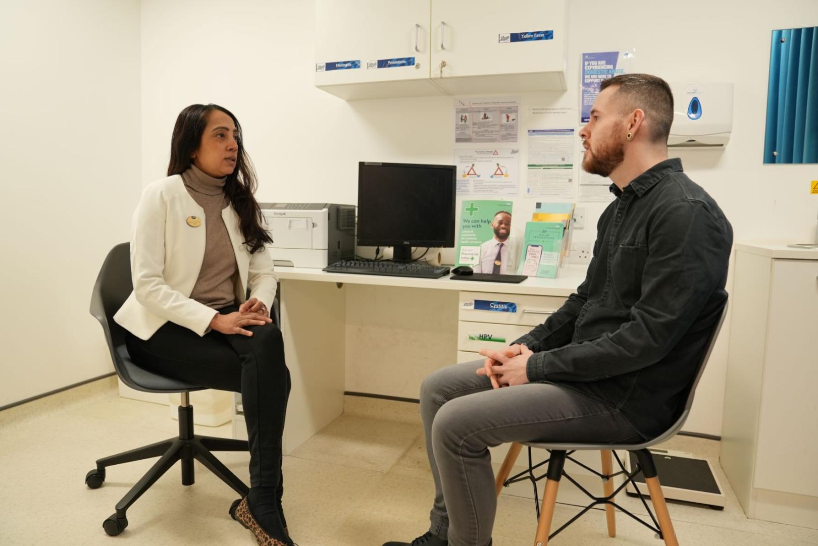 A Boots pharmacist completing a Pharmacy First patient consultation.