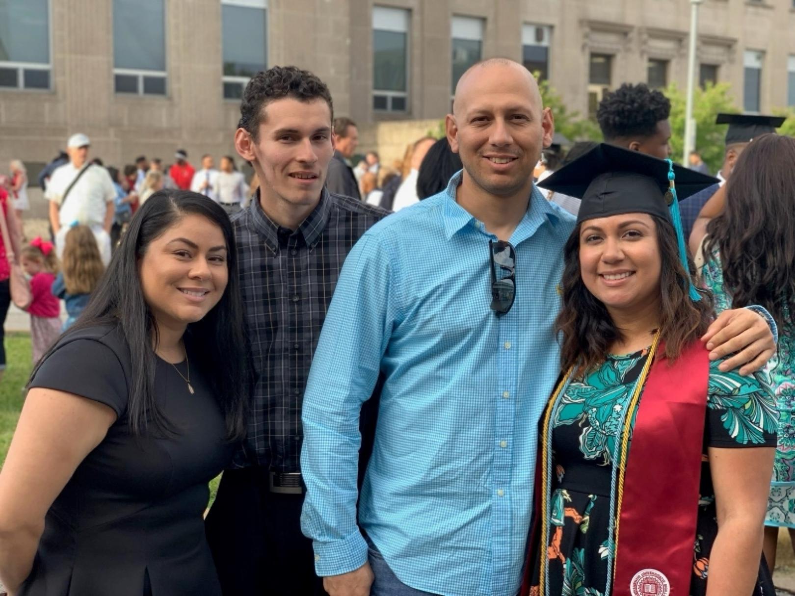 Abigail Jimenez stands with her three siblings after her graduation.