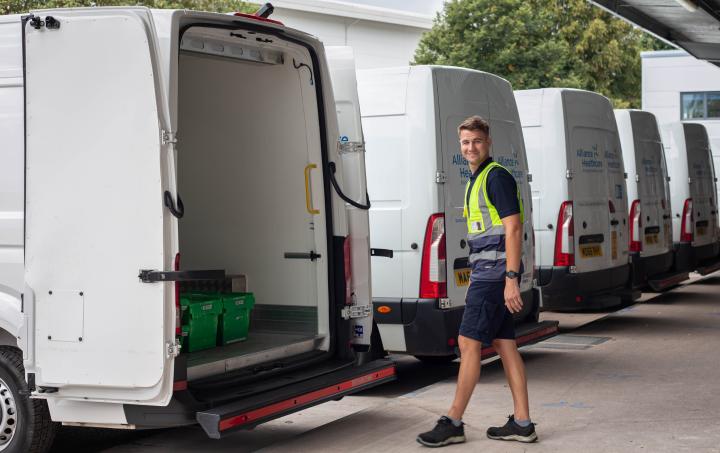 Alliance Healthcare driver walking towards an Alliance Healthcare van