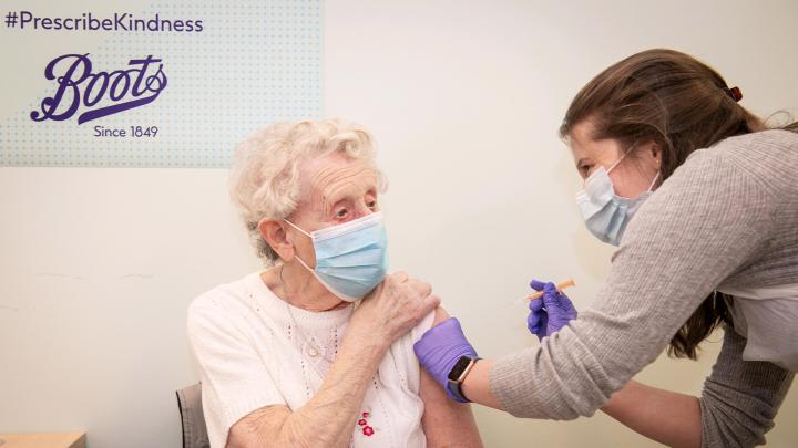 Lady receiving COVID vaccine