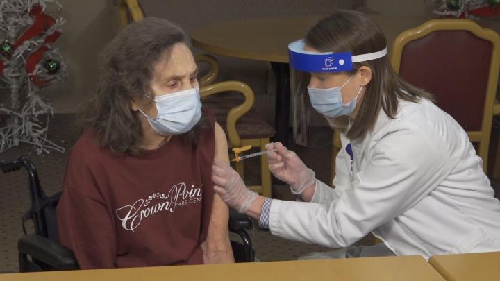 Kate Latta vaccinates a patient